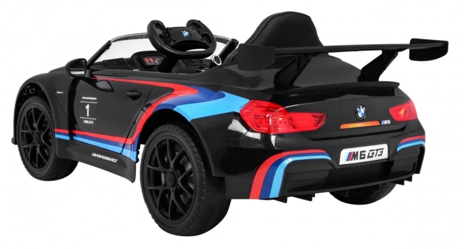 BMW M6 GT3 Auto a batteria per bambini nero + ventilazione + suoni MP3 Luci + telecomando