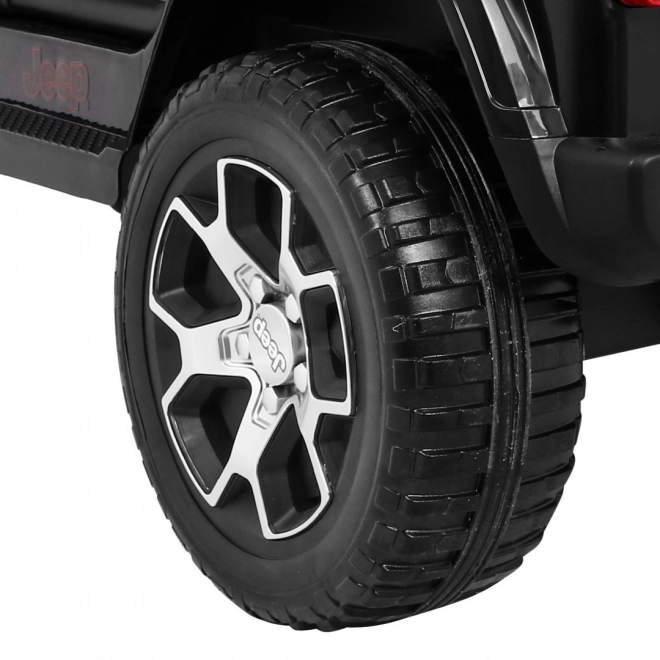 Jeep Wrangler Rubicon a batteria per bambini nera + telecomando + MP3 LED radio + ruote in EVA