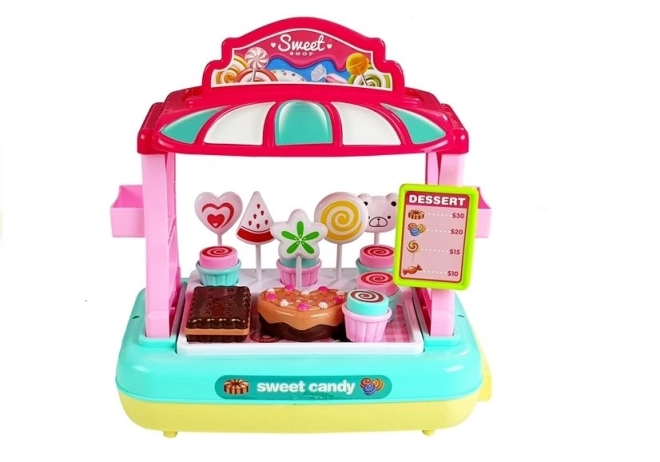 Cassa del registratore di cassa per bambini con stand di dolciumi