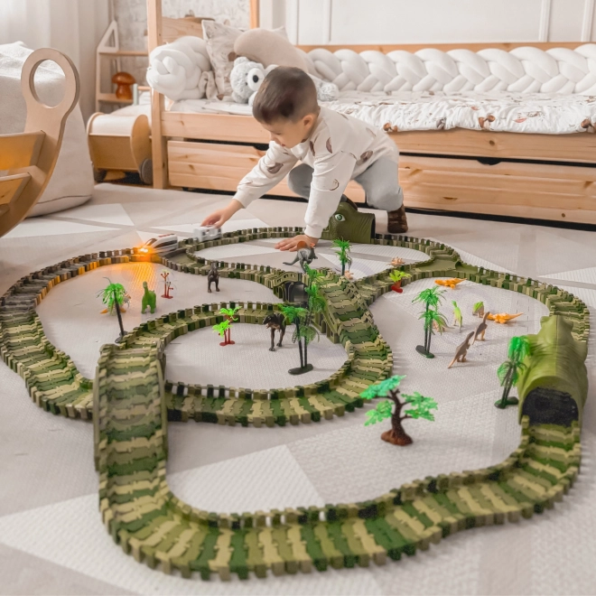 Pista da corsa di dinosauro con macchinina e figurine