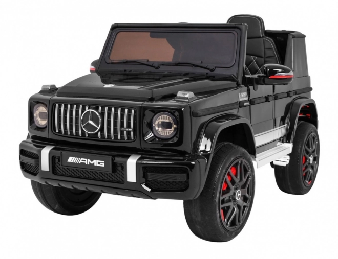 Mercedes AMG G63 per bambini Laccato nero + telecomando + MP3 LED + partenza lenta + EVA + cinture