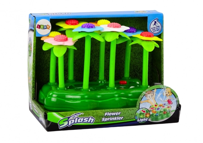 Gioco d'acqua da giardino con fiori e fontana luminosa per bambini