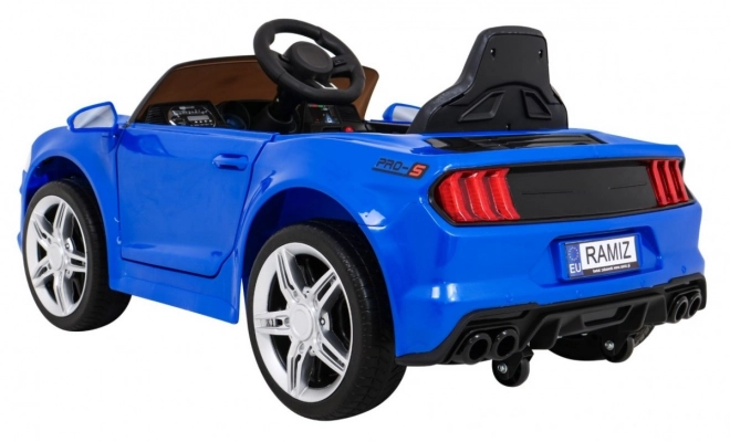 GT Macchina sportiva giocattolo a batteria per bambini blu + telecomando + partenza lenta + portapacchi + LED MP3