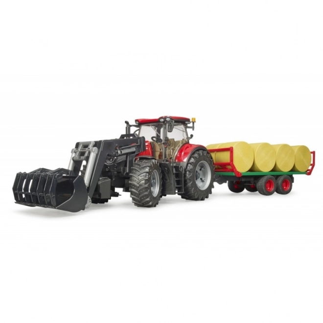 Trattore Bruder Case IH Optum 300 CVX con caricatore frontale e trasportatore per balle