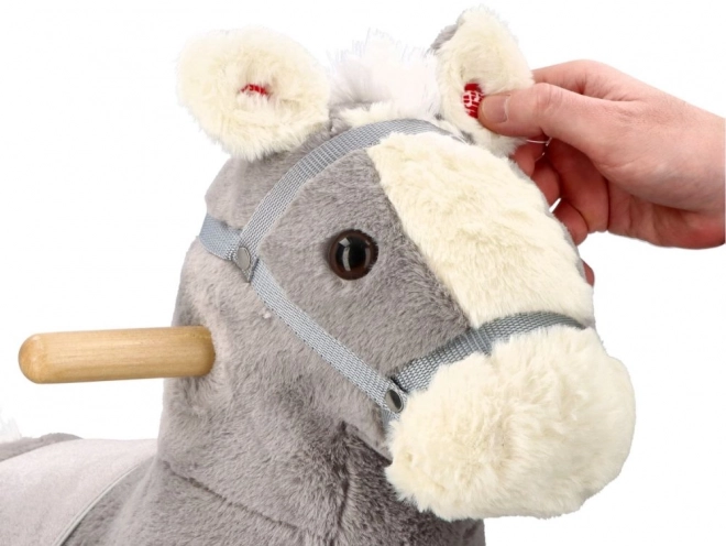 Cavallo a dondolo di peluche