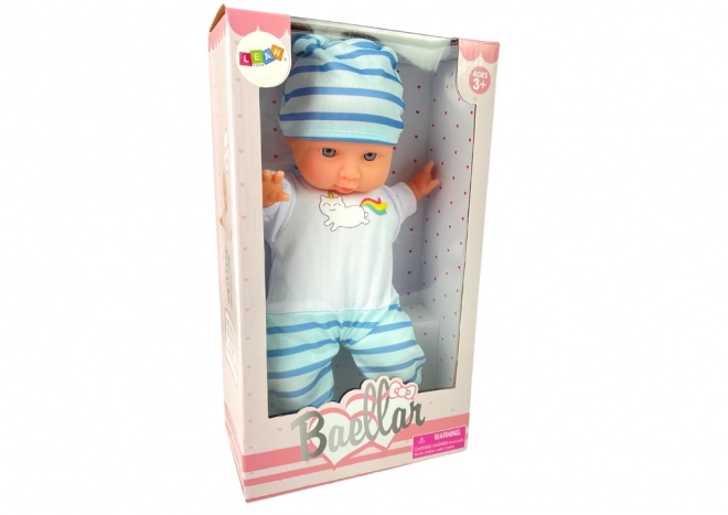 Bambola neonato con pigiama blu a righe