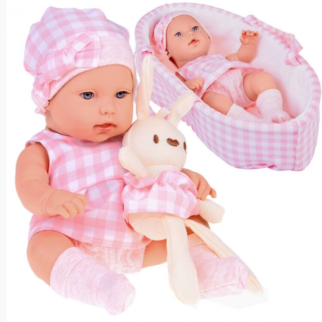 Bambola neonato con cappello rosa e vestito con coniglietto