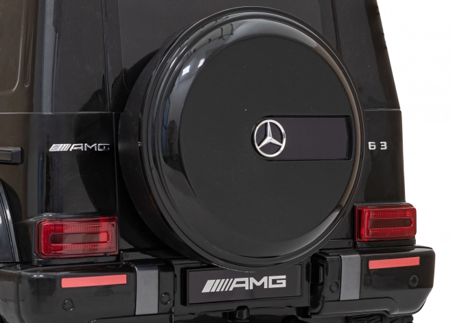 Mercedes AMG G63 per bambini nero + telecomando + MP3 LED + partenza lenta + EVA + cinture di sicurezza