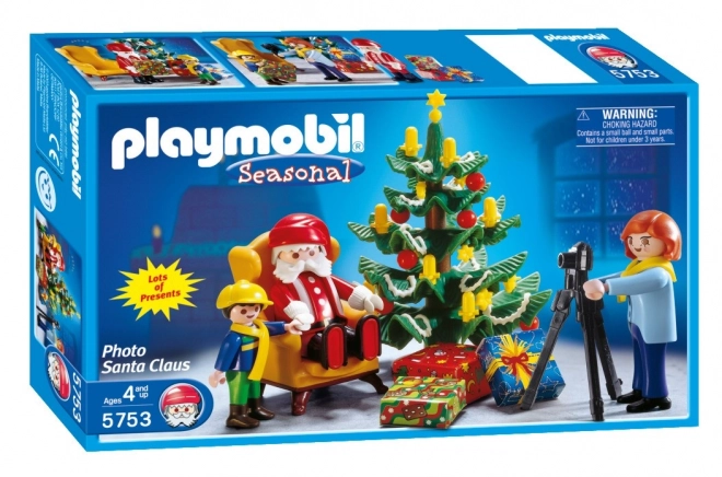 Set natalizio con figure e foto di Babbo Natale