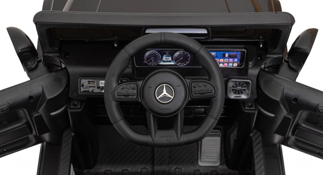 Mercedes AMG G63 per bambini nero + telecomando + MP3 LED + partenza lenta + EVA + cinture di sicurezza