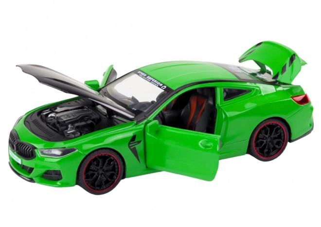 Auto sportiva verde in metallo con elementi apribili 1:24