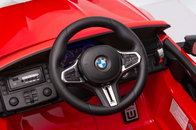 Auto a batteria BMW M5 con piattaforma per genitore rosso laccato