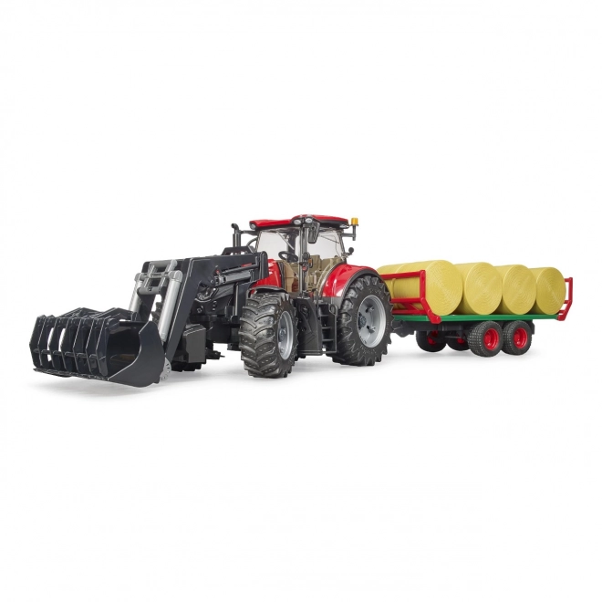 Trattore Bruder Case IH Optum 300 CVX con caricatore frontale e trasportatore per balle