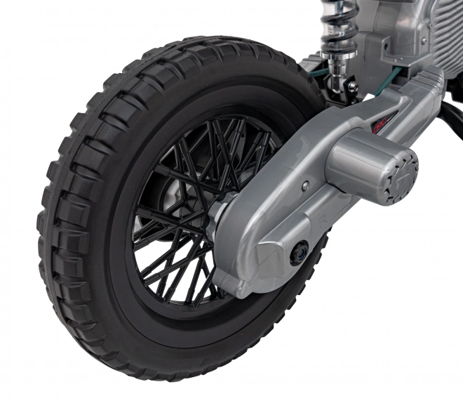 Moto verde per bambini a batteria con pannello audio e ruote in EVA