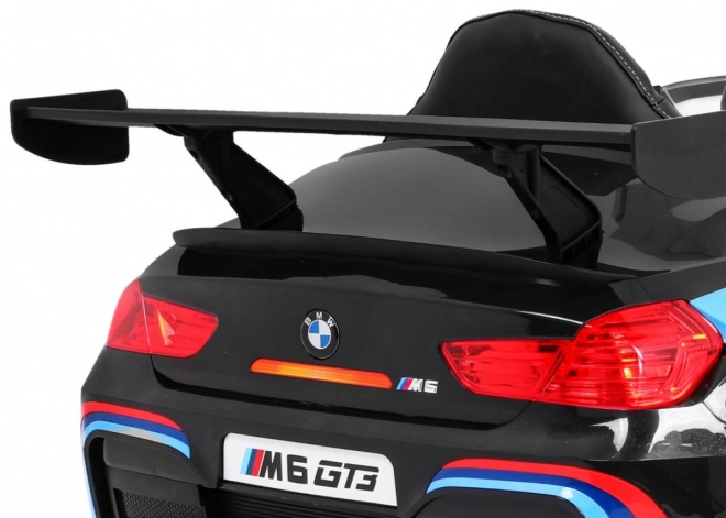 BMW M6 GT3 Auto a batteria per bambini nero + ventilazione + suoni MP3 Luci + telecomando