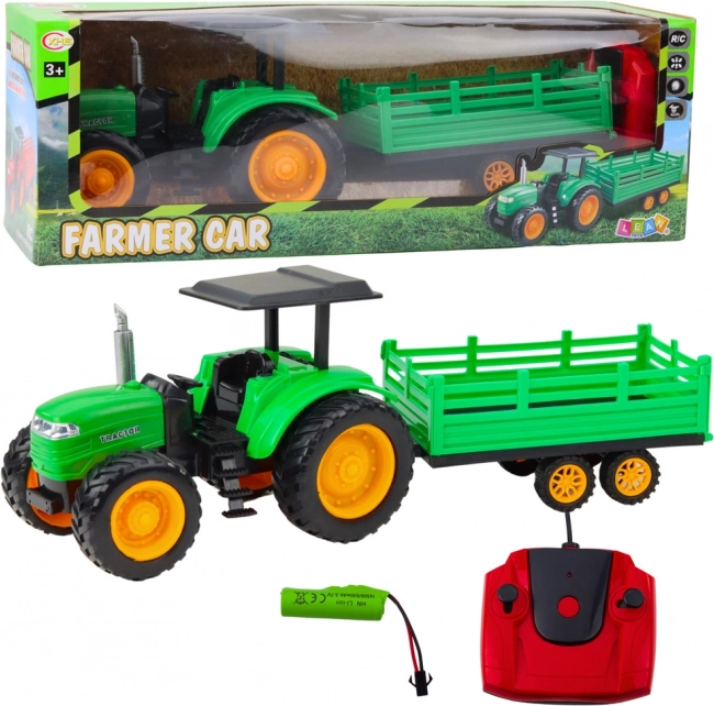 Trattore agricolo telecomandato verde con rimorchio