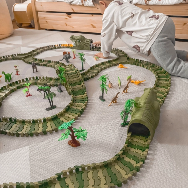 Pista da corsa di dinosauro con macchinina e figurine