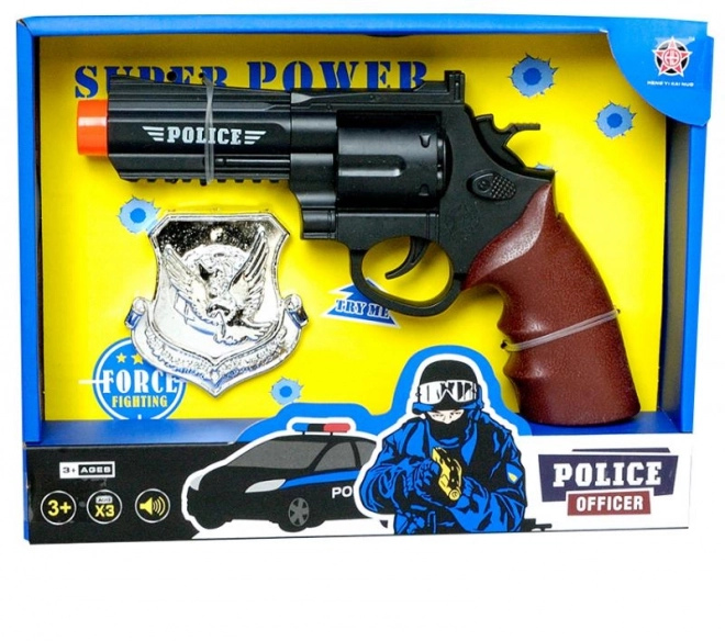 Pistola giocattolo con distintivo poliziesco