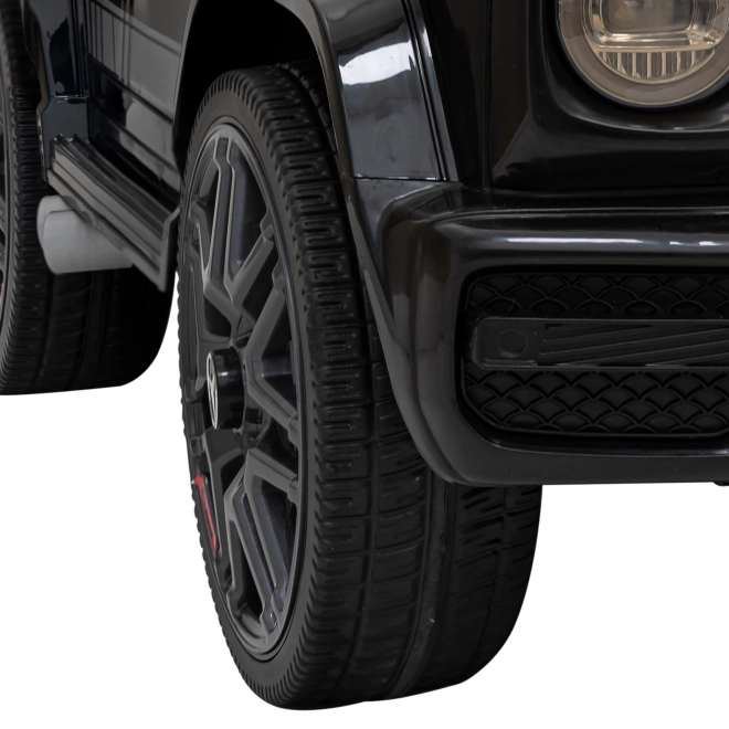Mercedes AMG G63 per bambini nero + telecomando + MP3 LED + partenza lenta + EVA + cinture di sicurezza
