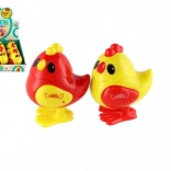 Pulcino saltellante a carica in plastica 7 × 9 cm, 2 colori