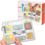 Tavola attiva con fibbie TAF TOYS per lo sviluppo della motricità fine
