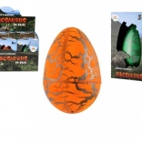 Uovo con dinosauro che si schiude